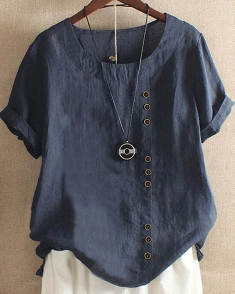 Kelly | Ensfarget kortermet bluse med rund hals