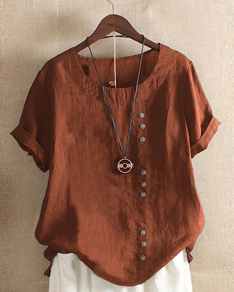 Kelly | Ensfarget kortermet bluse med rund hals