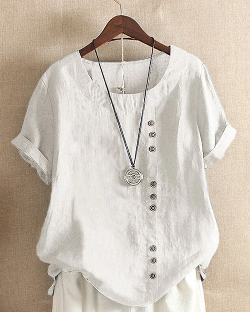 Kelly | Ensfarget kortermet bluse med rund hals