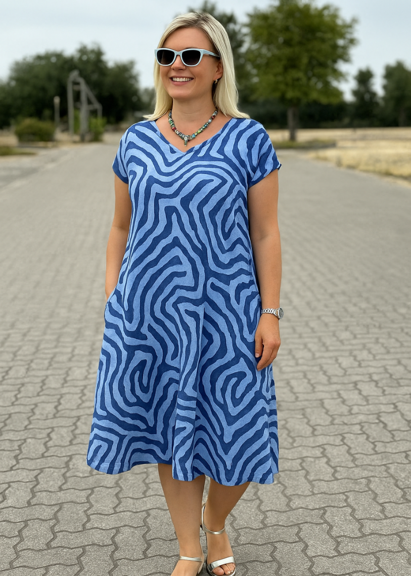 DE NELIA KJOLE